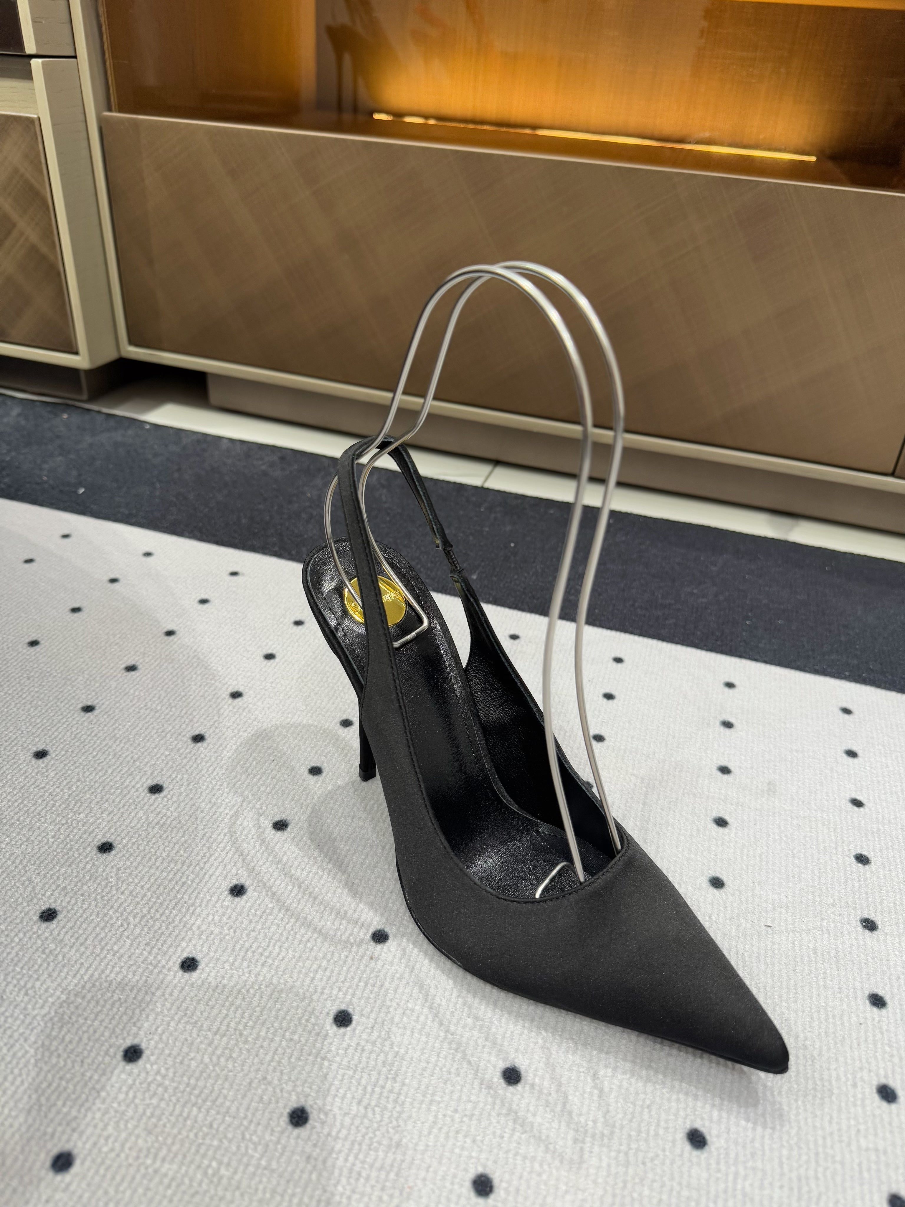 L'ENTRACTE SLINGBACK PUMPS IN BLACK SATIN