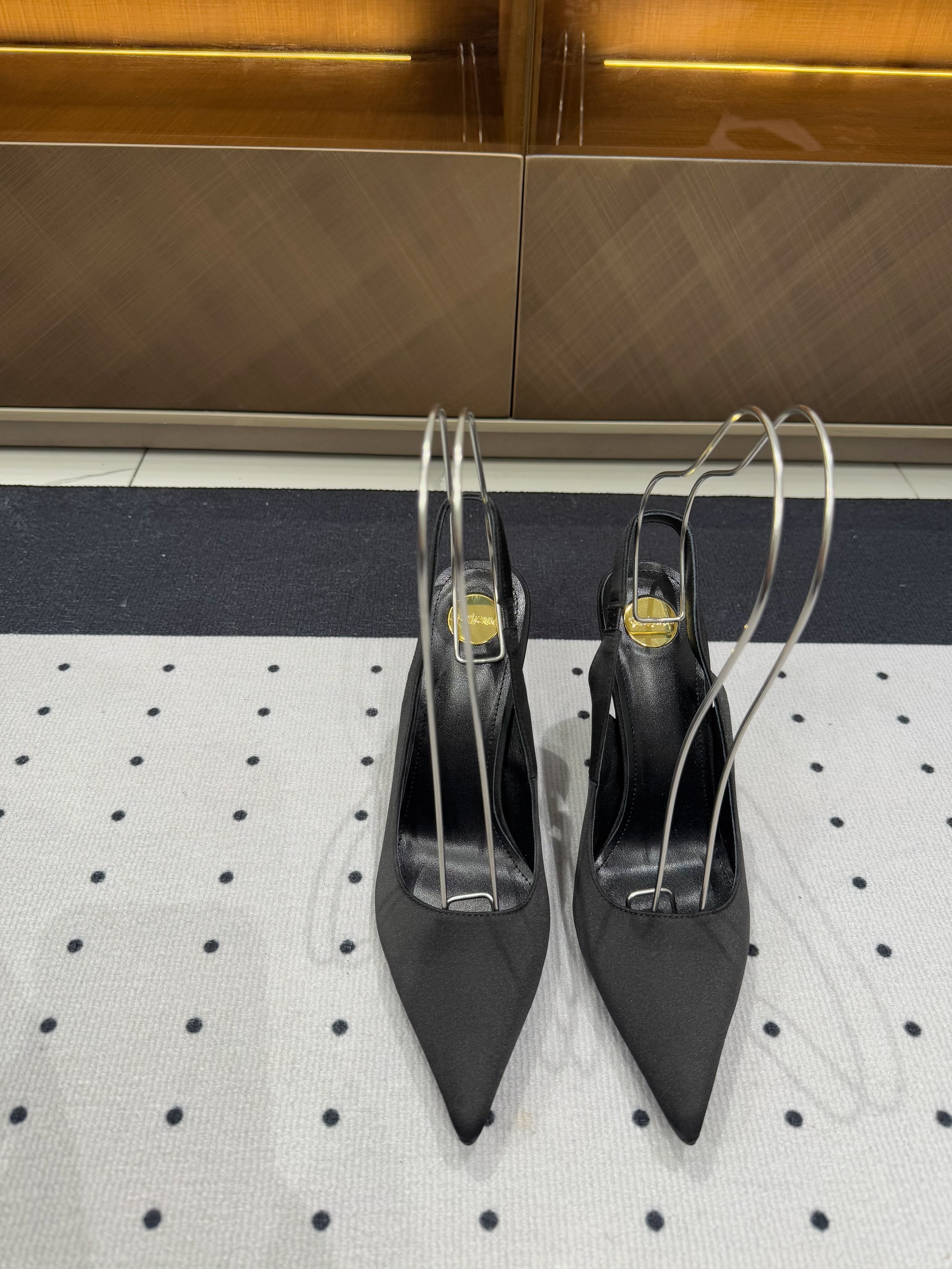 L'ENTRACTE SLINGBACK PUMPS IN BLACK SATIN