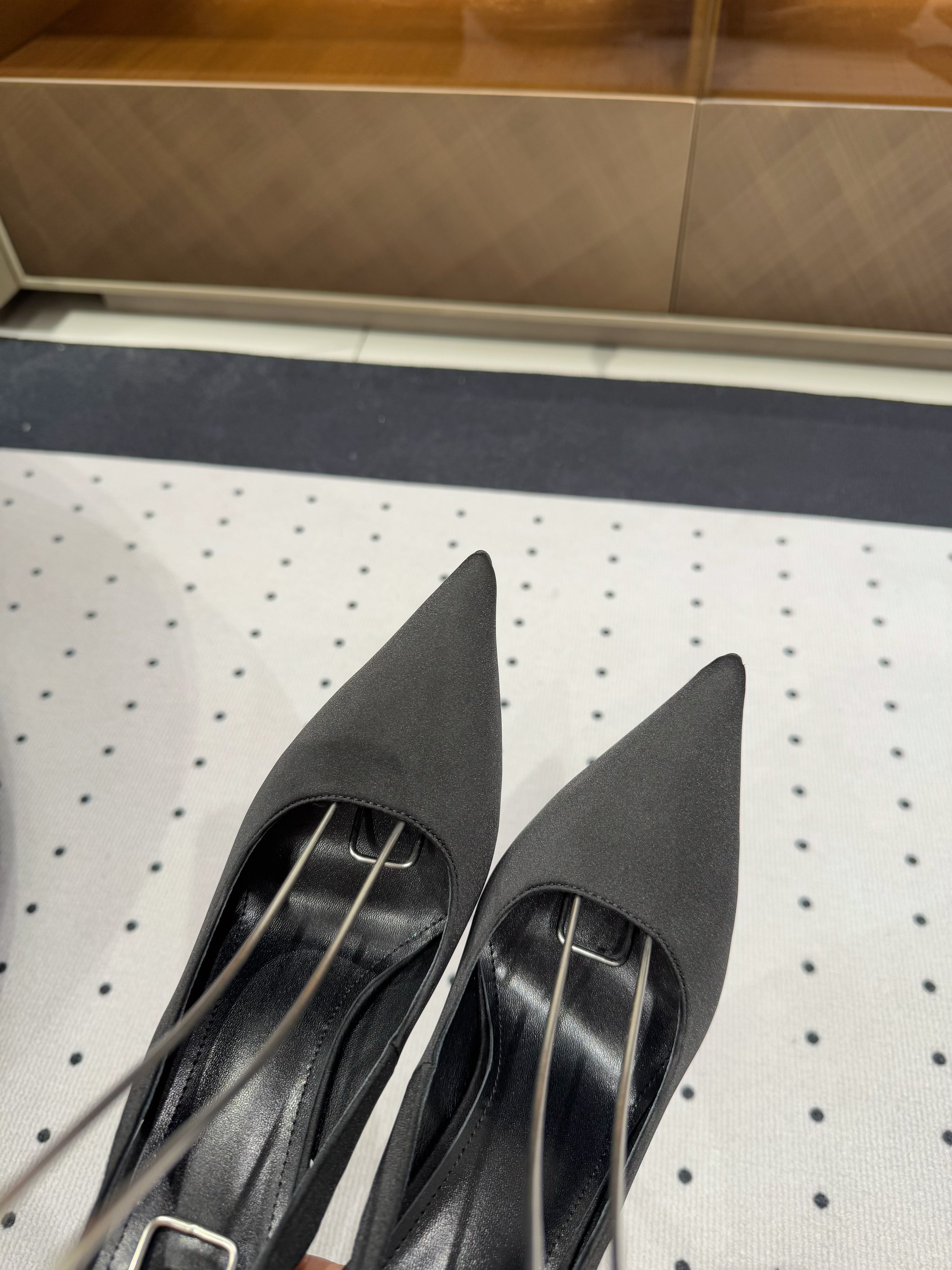 L'ENTRACTE SLINGBACK PUMPS IN BLACK SATIN