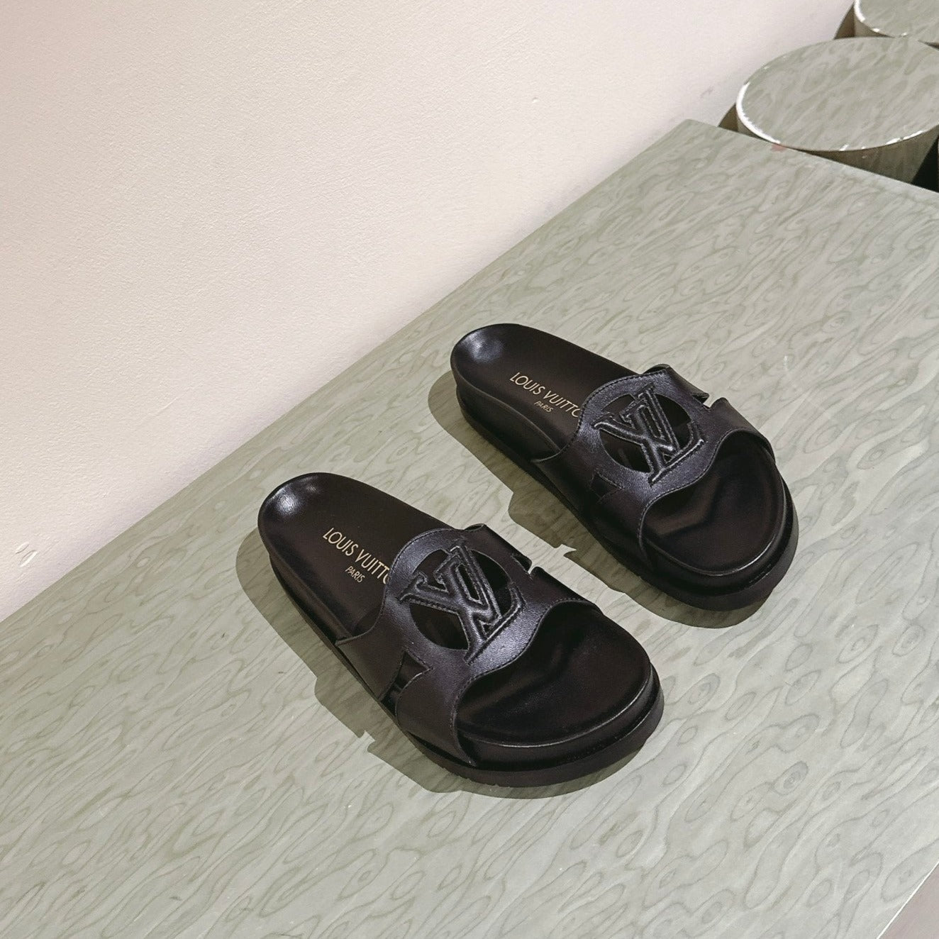 lv sandal isola flat mule black calfskin