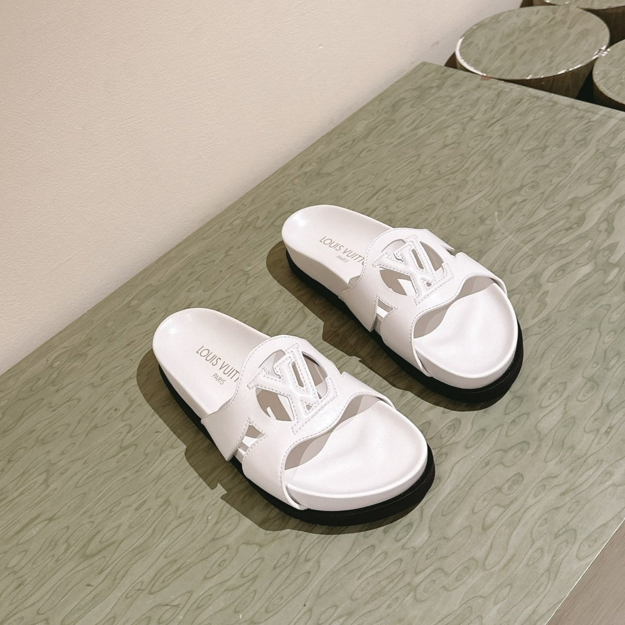 lv sandal isola flat mule white calfskin