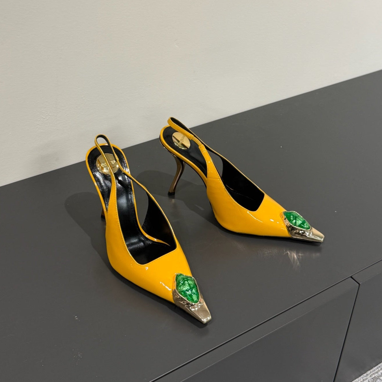 GREEN GEM-STUDDED SLINGBACK PUMPS IN YELLOW PATENT CALFSKIN