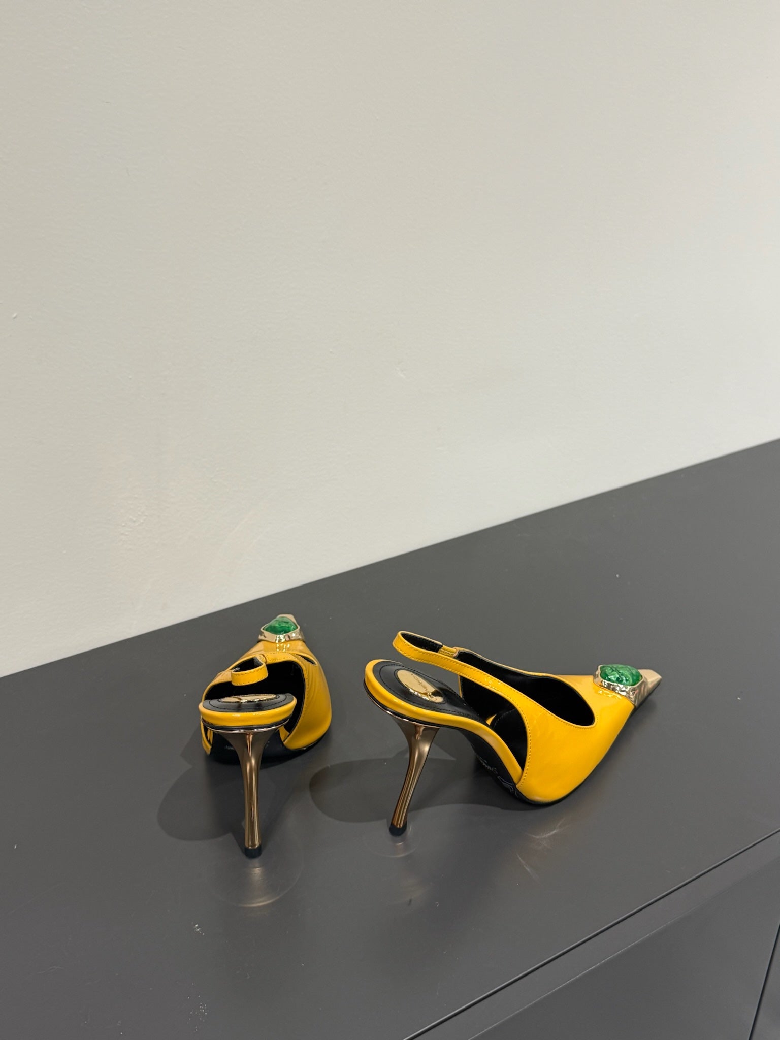 GREEN GEM-STUDDED SLINGBACK PUMPS IN YELLOW PATENT CALFSKIN