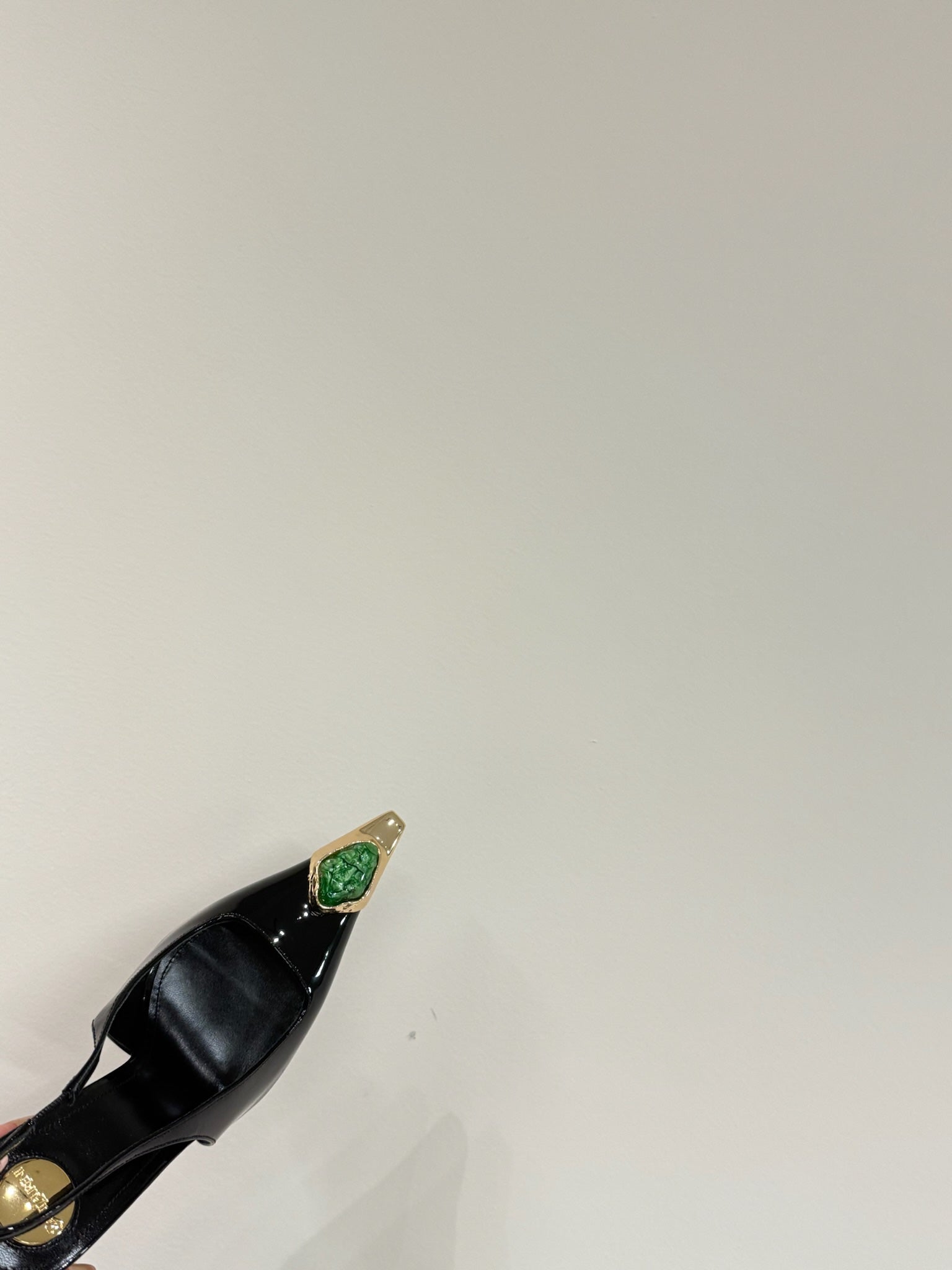 GREEN GEM-STUDDED SLINGBACK PUMPS IN BLACK PATENT CALFSKIN