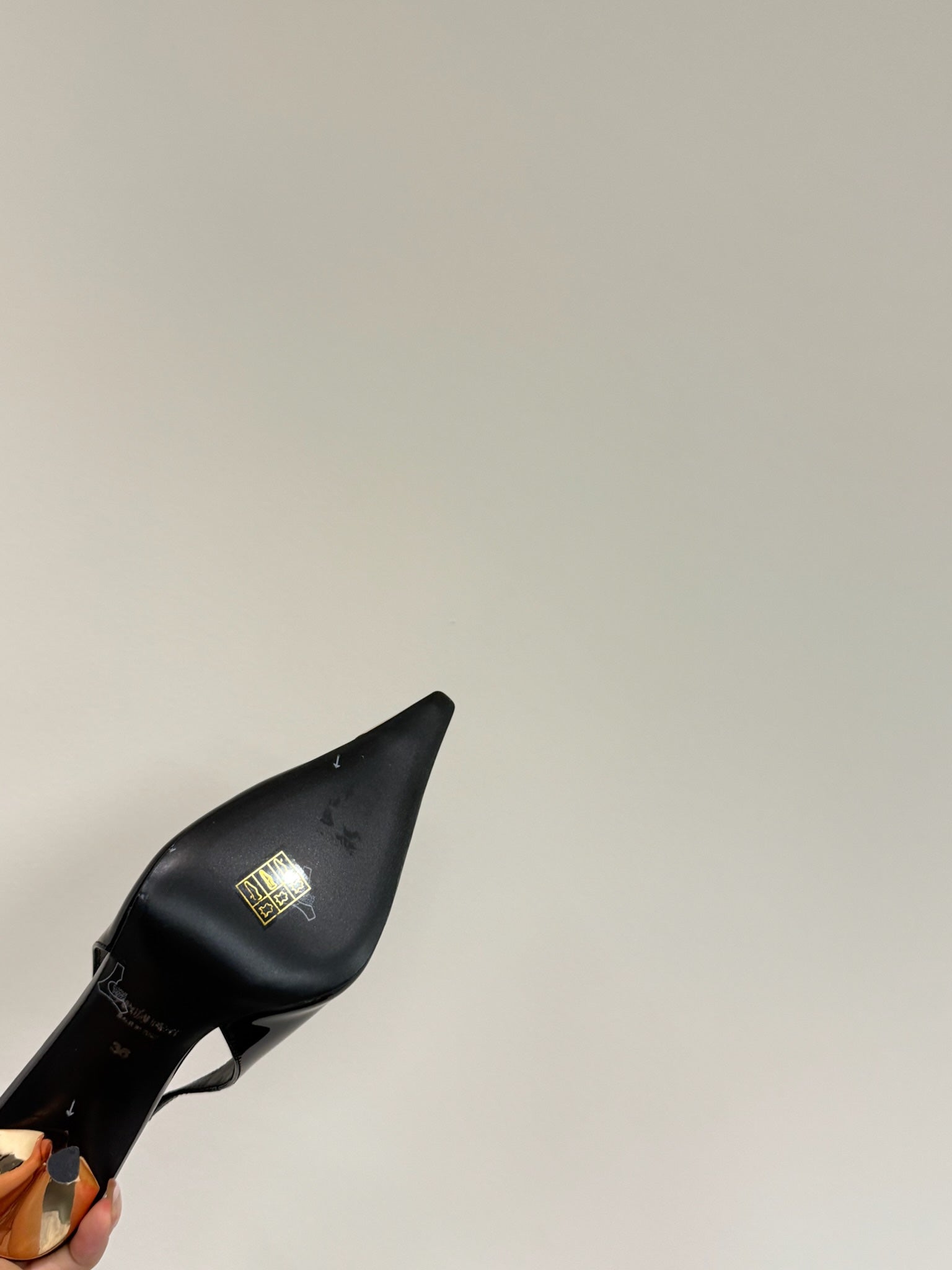 GREEN GEM-STUDDED SLINGBACK PUMPS IN BLACK PATENT CALFSKIN