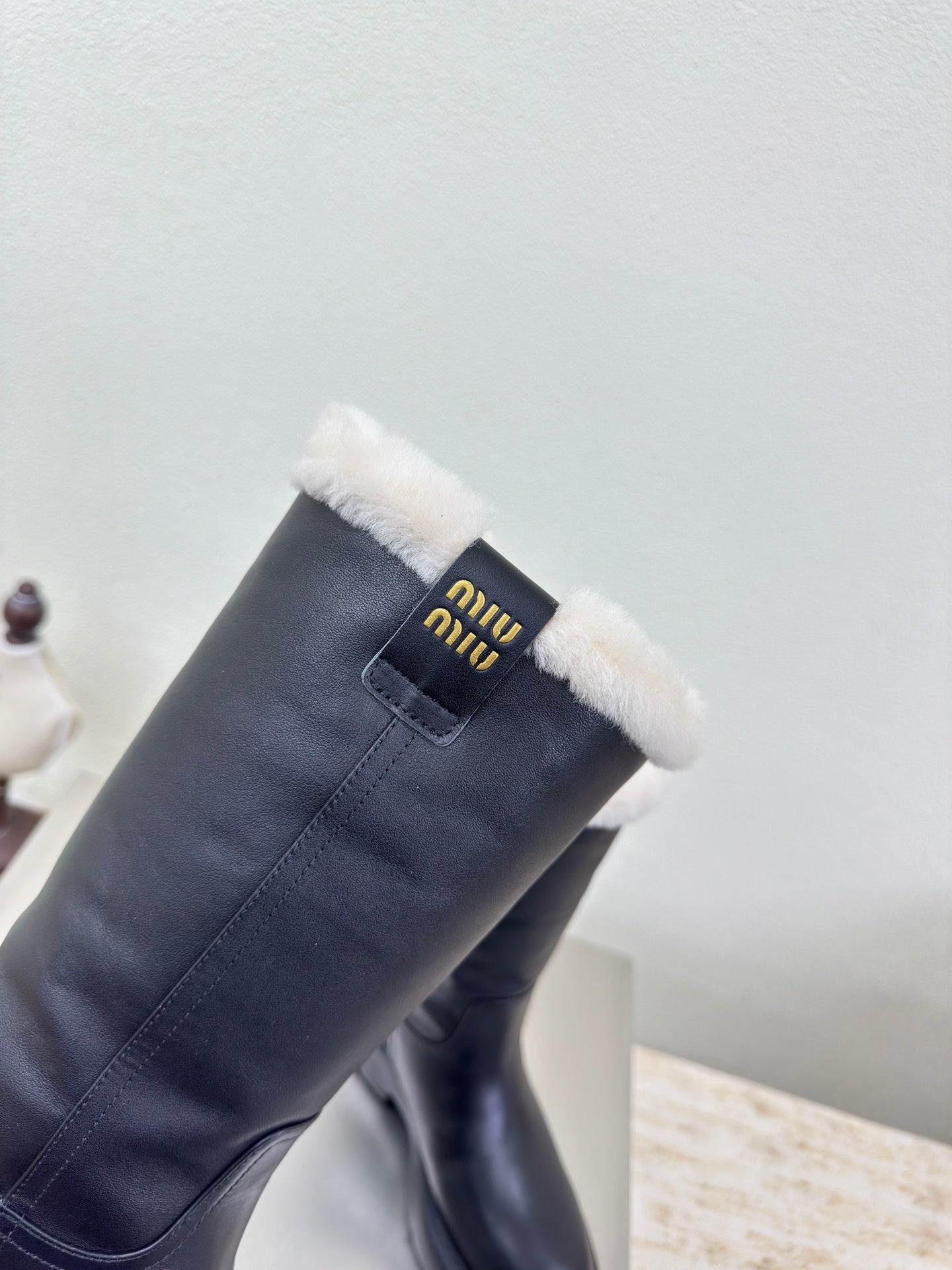 MiuMiu 25 platform boots black calfskin wool 522429