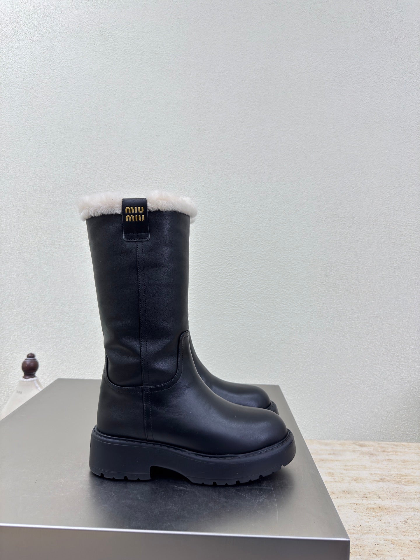 MiuMiu 25 platform boots black calfskin wool 522429