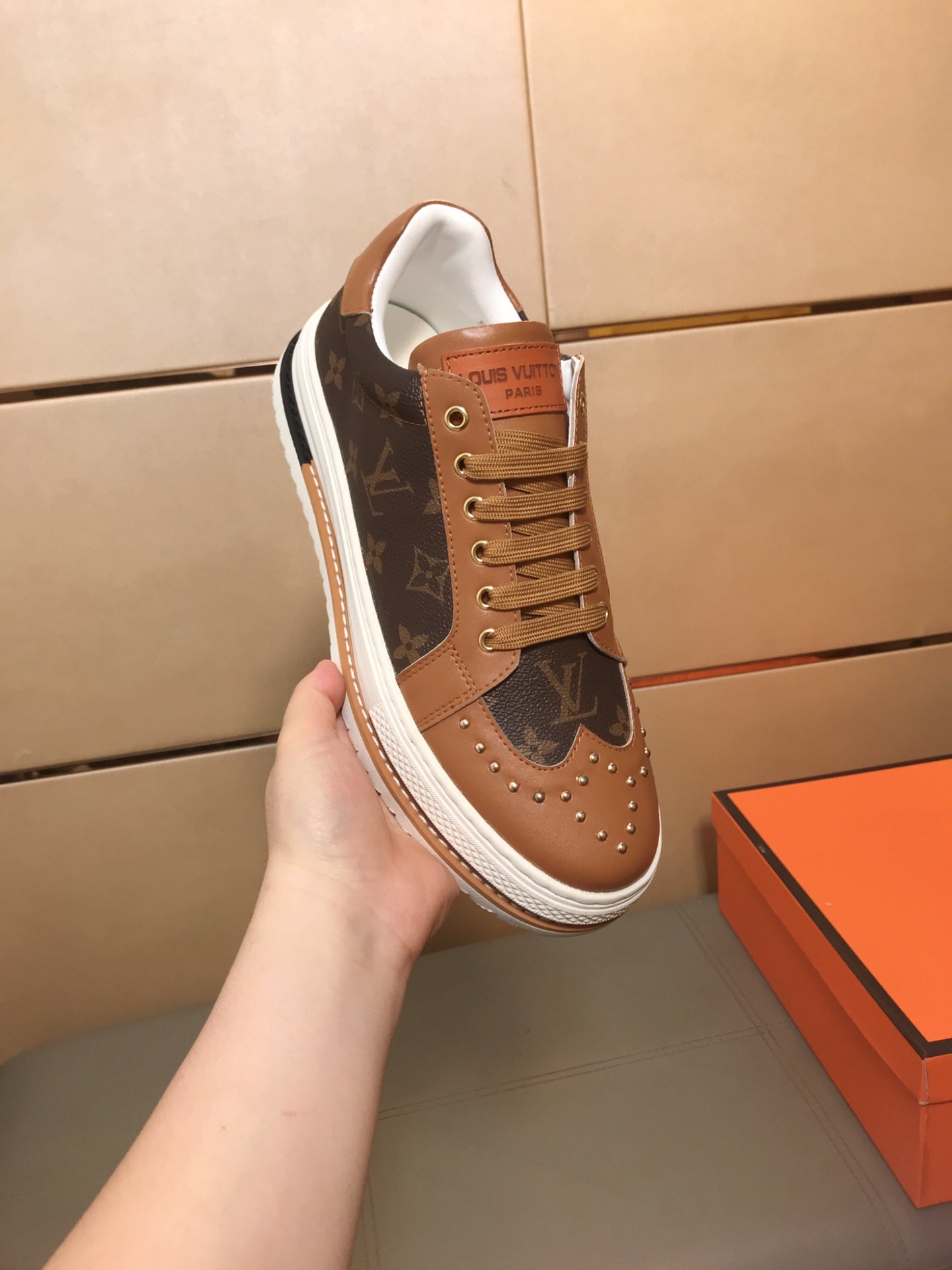 LV TRAINER IN BROWN MONOGRAM CALFSKIN