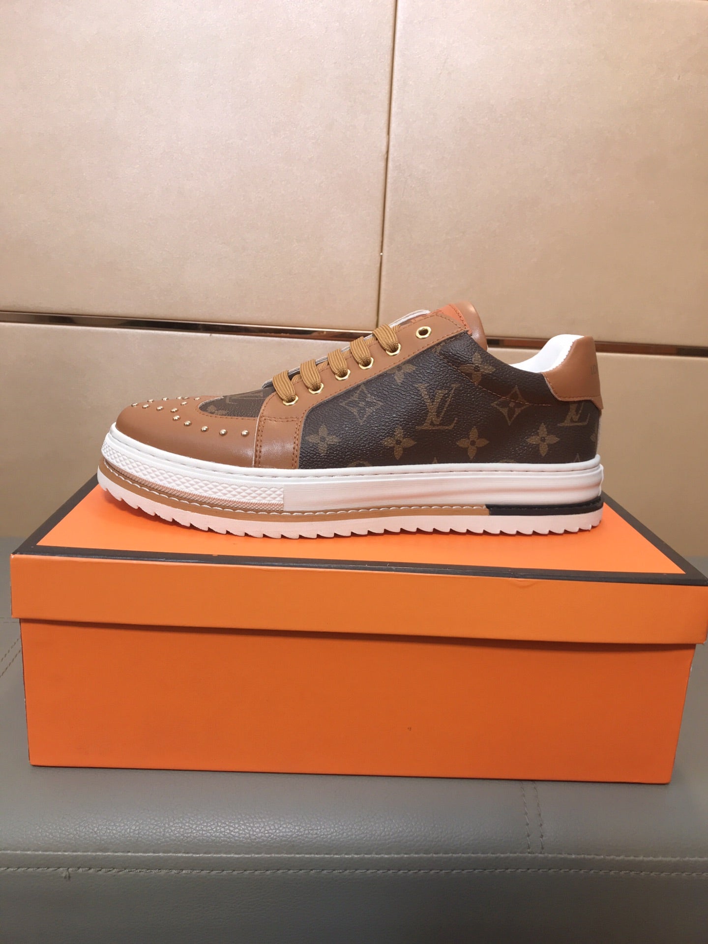 LV TRAINER IN BROWN MONOGRAM CALFSKIN