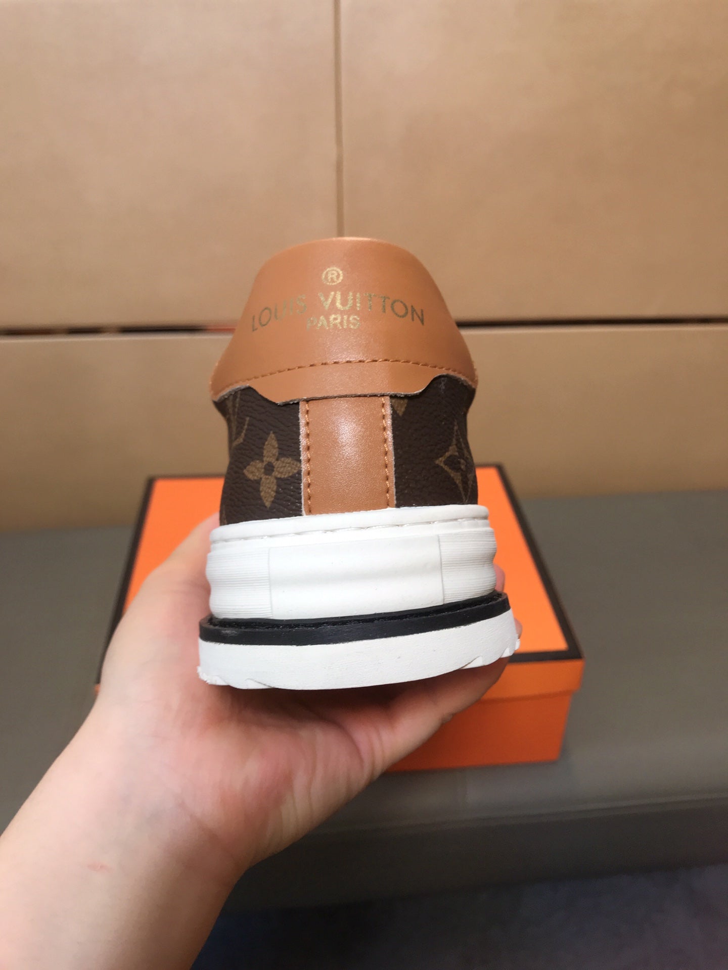 LV TRAINER IN BROWN MONOGRAM CALFSKIN