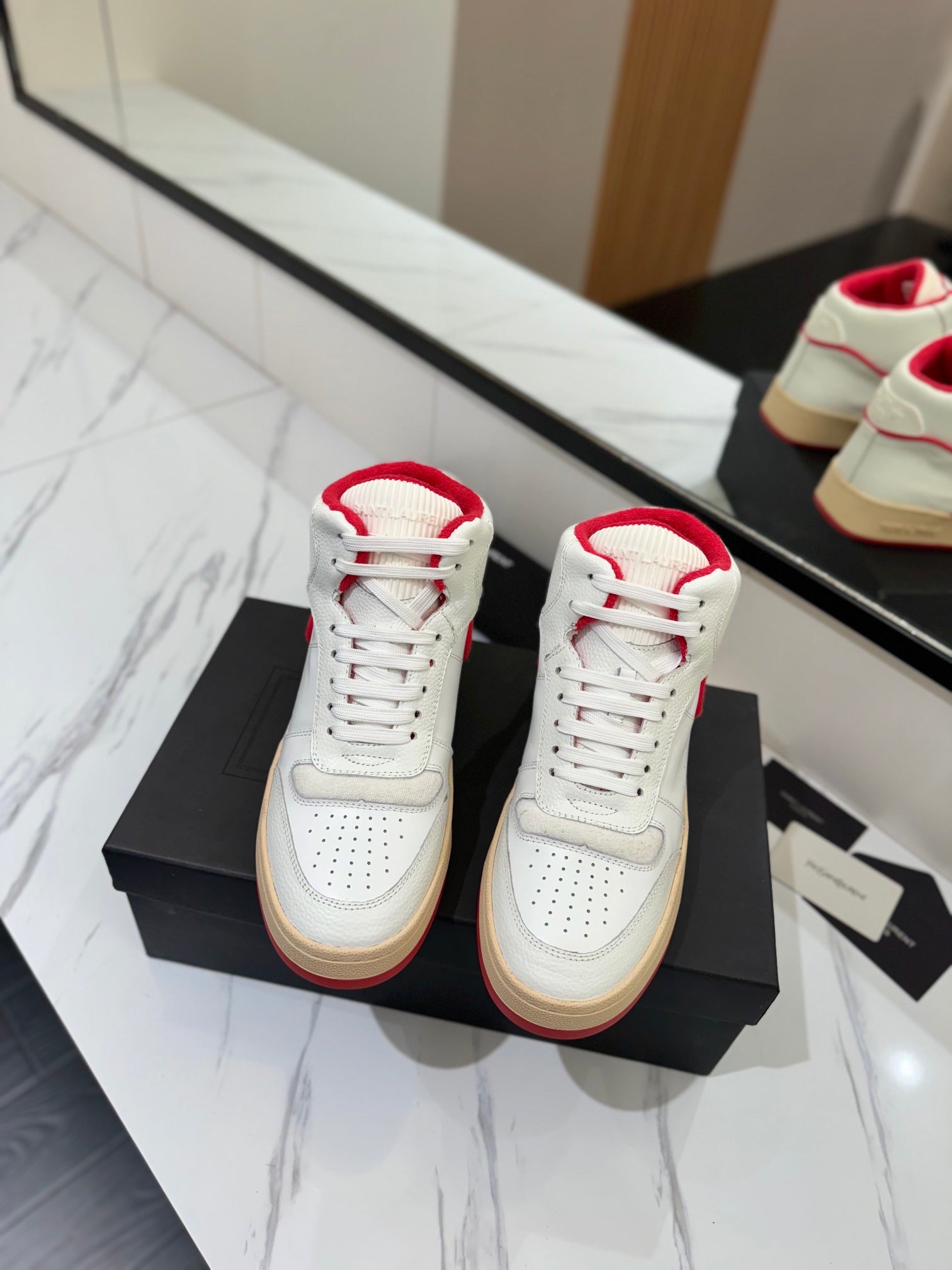 MID-TOP SNEAKERS IN WHITE AND RED TRIM PERFORATED LAMBSKIN